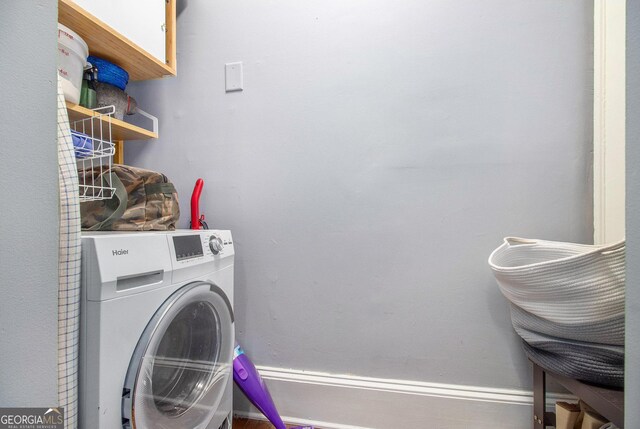 61 16th St NE Unit 4, Atlanta, GA 30309 - washroom with washer / dryer and baseboards