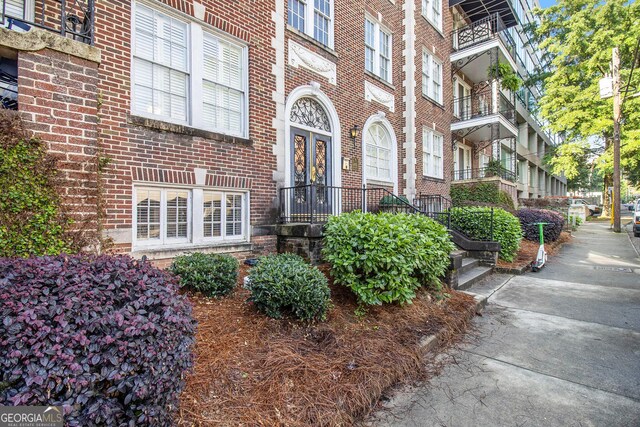 61 16th St NE Unit 4, Atlanta, GA 30309 - property entrance featuring brick siding