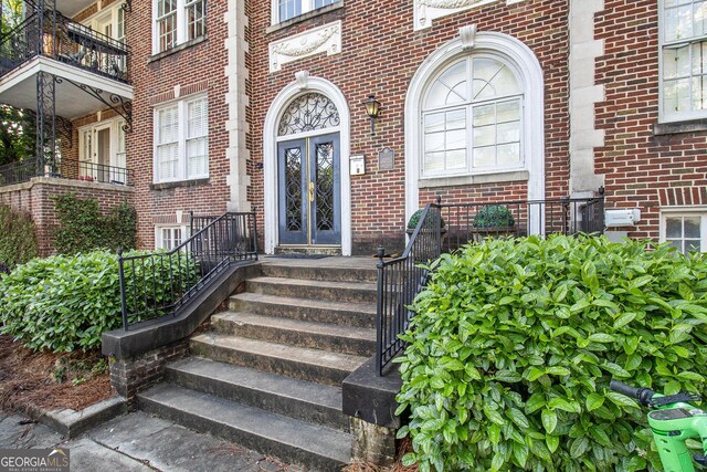 61 16th St NE Unit 4, Atlanta, GA 30309 - entrance to property with brick siding and french doors