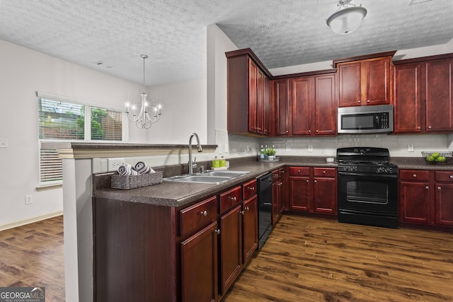 867 Crested Hawk Trl, Sugar Hill, GA 30518 - kitchen featuring black appliances, dark brown cabinets, dark countertops, dark wood-style flooring, and a textured ceiling