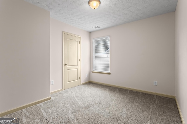 867 Crested Hawk Trl, Sugar Hill, GA 30518 - carpeted spare room featuring baseboards and a textured ceiling