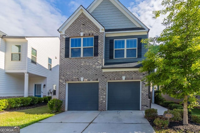4183 May Apple Ln, Atlanta, GA 30349 - view of front of property with concrete driveway, brick siding, and a garage