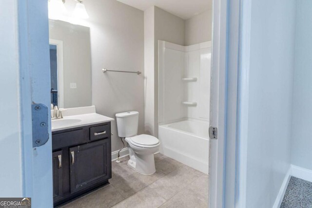 4183 May Apple Ln, Atlanta, GA 30349 - bathroom with toilet, vanity, baseboards, and shower / bathtub combination