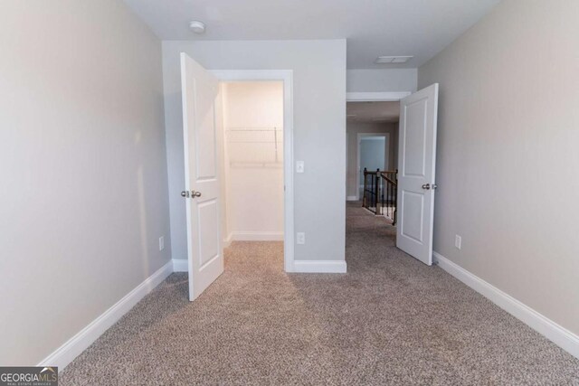 4183 May Apple Ln, Atlanta, GA 30349 - unfurnished bedroom featuring carpet and baseboards