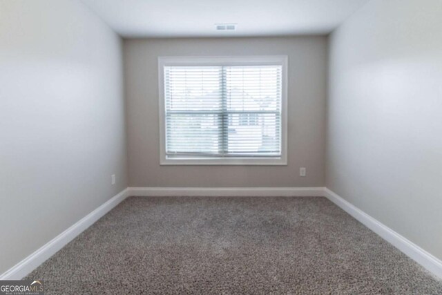 4183 May Apple Ln, Atlanta, GA 30349 - carpeted spare room featuring baseboards