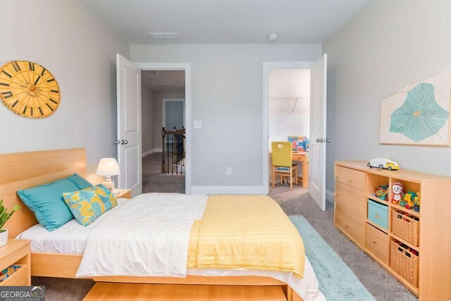 4183 May Apple Ln, Atlanta, GA 30349 - bedroom featuring light colored carpet and baseboards