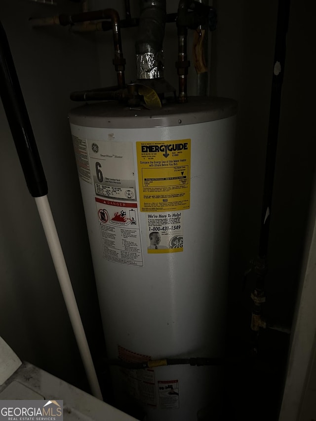 utility room with water heater