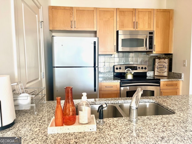 325 E Paces Ferry Rd NE Unit 1606, Atlanta, GA 30305 - kitchen with stainless steel appliances, backsplash, and light stone counters