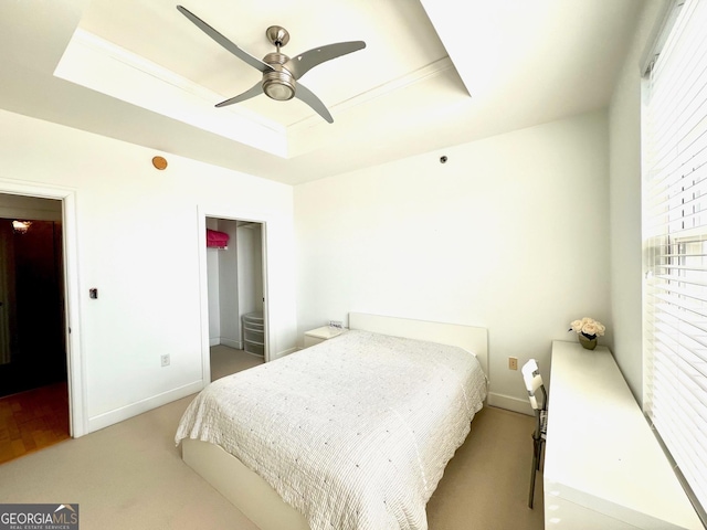 325 E Paces Ferry Rd NE Unit 1606, Atlanta, GA 30305 - bedroom with a tray ceiling, baseboards, and carpet flooring