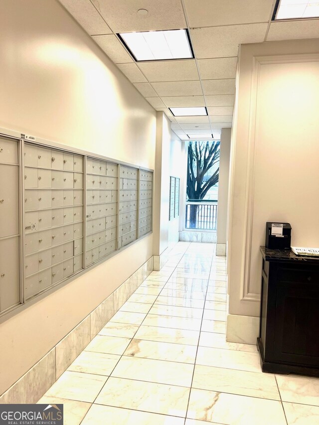325 E Paces Ferry Rd NE Unit 1606, Atlanta, GA 30305 - hall featuring mail area and a paneled ceiling