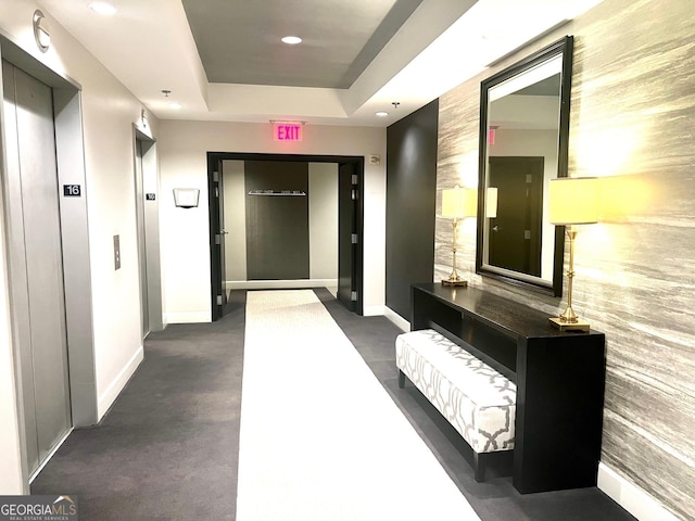 325 E Paces Ferry Rd NE Unit 1606, Atlanta, GA 30305 - corridor with elevator, baseboards, a raised ceiling, and recessed lighting