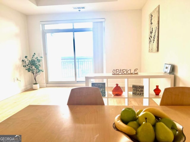 325 E Paces Ferry Rd NE Unit 1606, Atlanta, GA 30305 - dining space with wood finished floors and baseboards