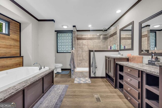 315 April Trce, Dawsonville, GA 30534 - bathroom featuring a walk in shower, toilet, wood finished floors, a bath, and vanity