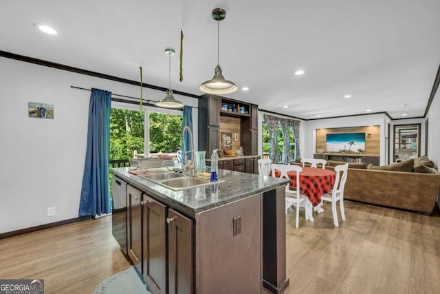 315 April Trce, Dawsonville, GA 30534 - kitchen with a sink, ornamental molding, light wood finished floors, recessed lighting, and baseboards