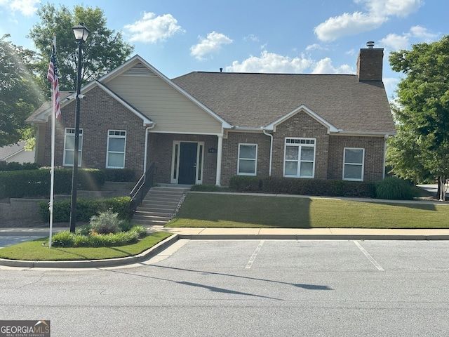 125 Villa Park Cir, Stone Mountain, GA 30087 - single story home with brick siding, a chimney, and a front lawn