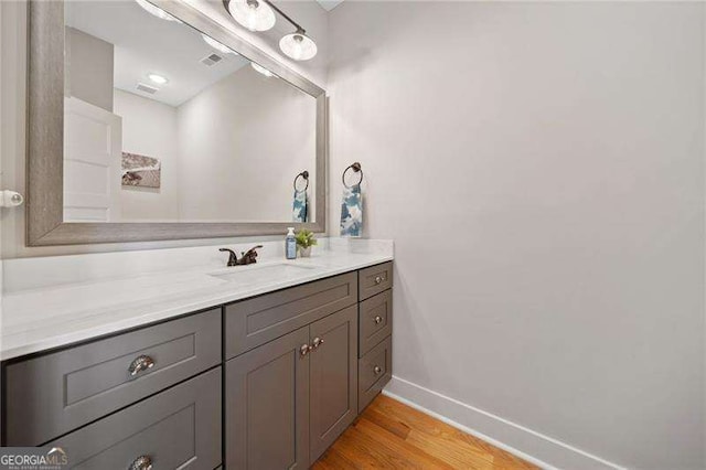8007 Wishaw Ct, Douglasville, GA 30187 - bathroom featuring wood finished floors, vanity, and baseboards