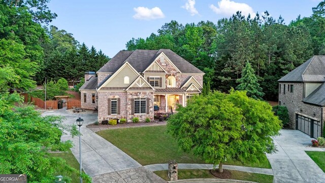 3302 Anna Ruby Ln, Buford, GA 30519 - craftsman-style home with driveway, stone siding, and a front lawn