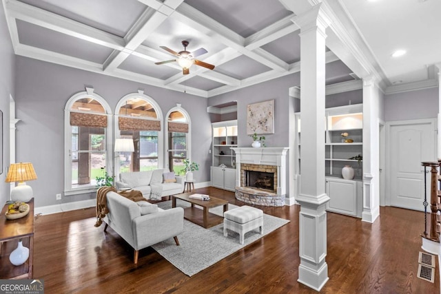 3302 Anna Ruby Ln, Buford, GA 30519 - living area featuring decorative columns, a ceiling fan, a fireplace, dark wood-style floors, and beamed ceiling