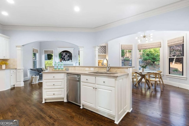 3302 Anna Ruby Ln, Buford, GA 30519 - kitchen featuring stainless steel dishwasher, a sink, arched walkways, crown molding, and open floor plan