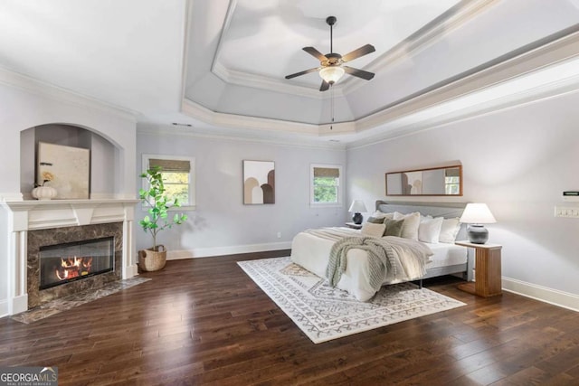 3302 Anna Ruby Ln, Buford, GA 30519 - bedroom featuring crown molding, hardwood / wood-style floors, a premium fireplace, a tray ceiling, and baseboards