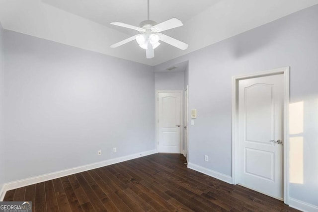 3302 Anna Ruby Ln, Buford, GA 30519 - unfurnished bedroom with dark wood-type flooring, baseboards, and ceiling fan