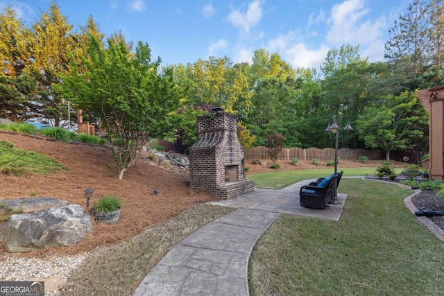 3302 Anna Ruby Ln, Buford, GA 30519 - view of yard featuring an outdoor brick fireplace and a patio