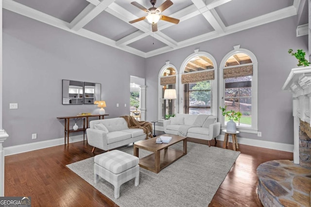 3302 Anna Ruby Ln, Buford, GA 30519 - living room featuring a ceiling fan, a stone fireplace, coffered ceiling, wood finished floors, and beamed ceiling