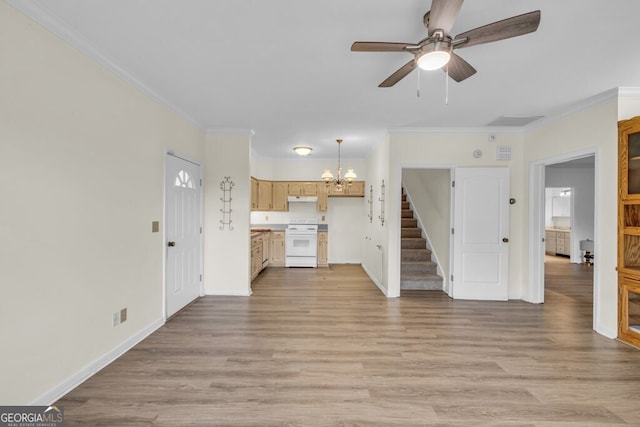 unfurnished living room featuring stairway, a chandelier, a ceiling fan, crown molding, and baseboards