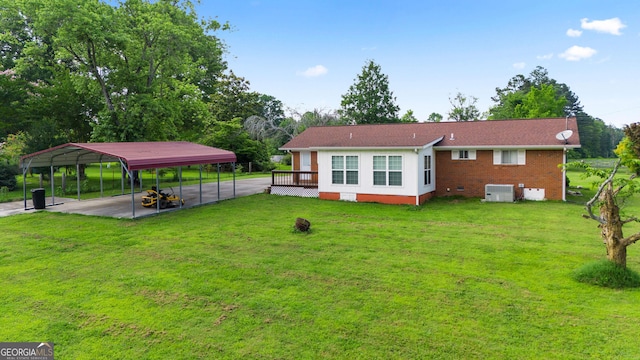 701 W Nance Springs Rd SW, Dalton, GA 30721 - back of house featuring a lawn, a detached carport, and driveway