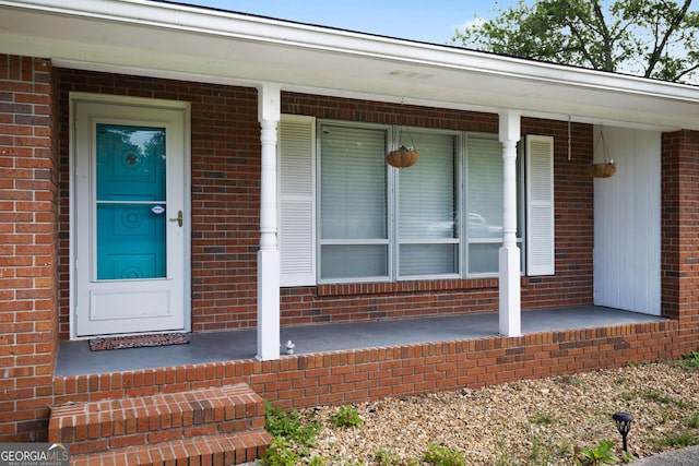 701 W Nance Springs Rd SW, Dalton, GA 30721 - view of exterior entry featuring brick siding and covered porch