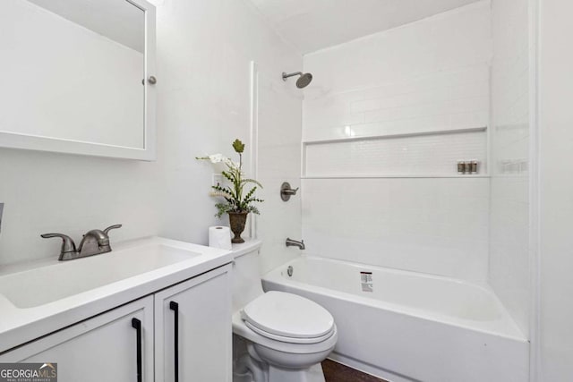 bathroom with toilet, vanity, and tub / shower combination