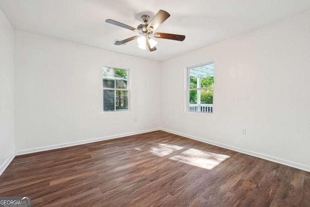 unfurnished room featuring wood finished floors, baseboards, and ceiling fan