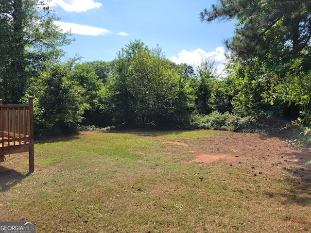 1094 Reynolds Ct, Morrow, GA 30260 - view of grassy yard with a wooden deck