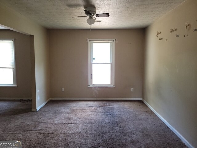 1094 Reynolds Ct, Morrow, GA 30260 - empty room with carpet flooring, a textured ceiling, ceiling fan, and baseboards