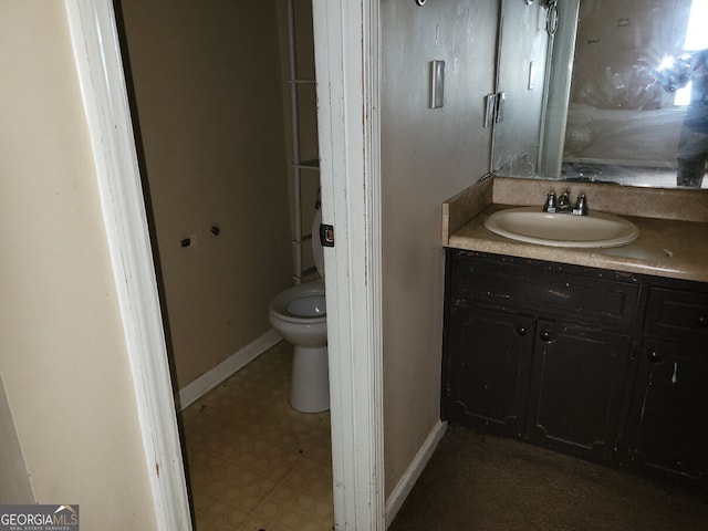 1094 Reynolds Ct, Morrow, GA 30260 - bathroom featuring vanity, toilet, and baseboards
