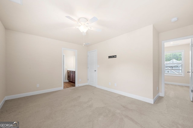 2431 Kingston Heath Way, Marietta, GA 30008 - empty room with light carpet, a ceiling fan, baseboards, and a smoke detector