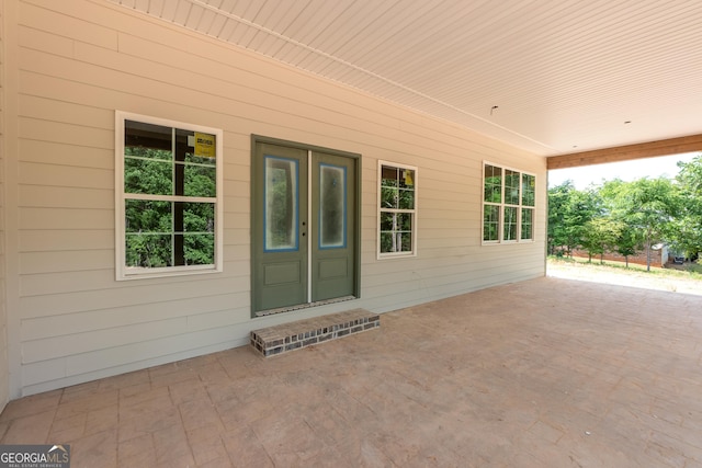 doorway to property with a patio area