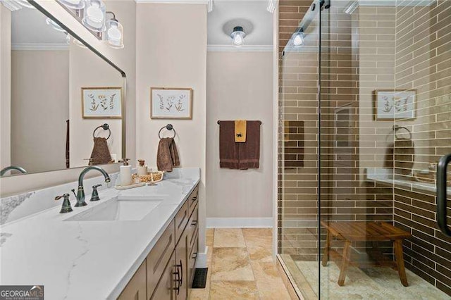 full bathroom featuring crown molding, a stall shower, vanity, and baseboards