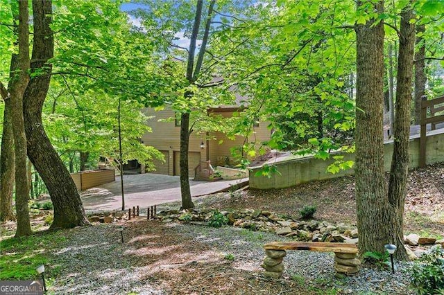 view of yard featuring a patio area and a garage