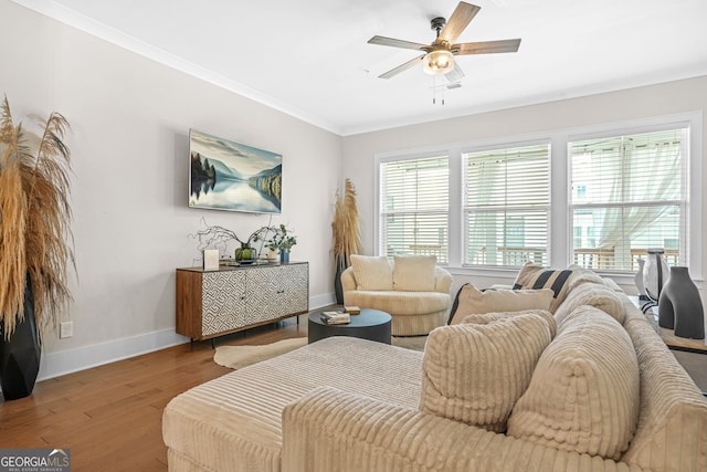2744 Bell Dr SE, Smyrna, GA 30080 - living area with baseboards, wood finished floors, crown molding, and a ceiling fan