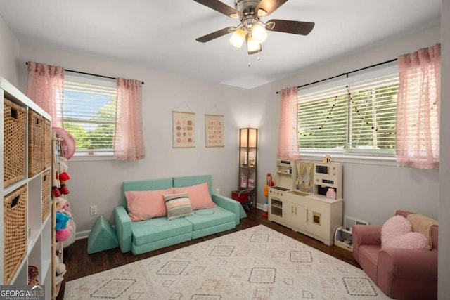 283 Norton Cir SE, Smyrna, GA 30082 - living area featuring wood finished floors, healthy amount of natural light, ceiling fan, and baseboards