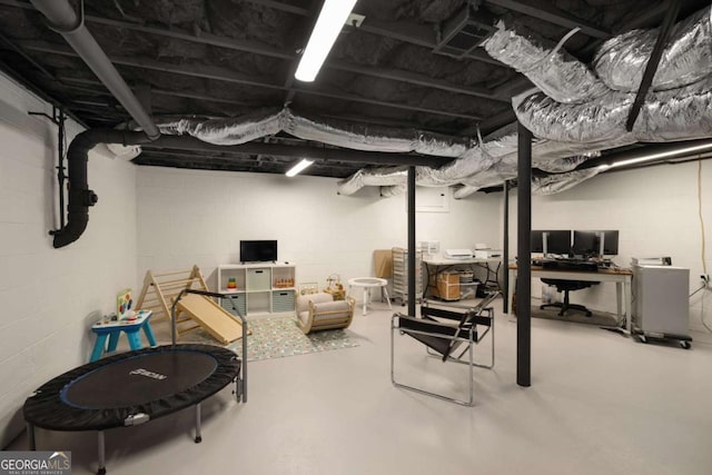 283 Norton Cir SE, Smyrna, GA 30082 - below grade area featuring a desk and concrete block wall