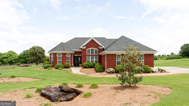 1365 Ivy Plantation, Monroe, GA 30656 - view of front of home with brick siding, a front lawn, and a shingled roof