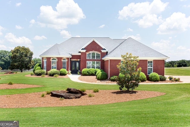 1365 Ivy Plantation, Monroe, GA 30656 - view of front of home featuring brick siding and a front lawn
