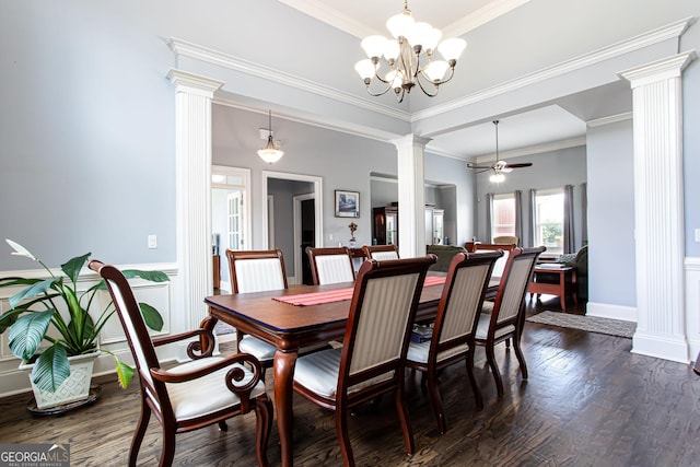 1365 Ivy Plantation, Monroe, GA 30656 - dining area featuring decorative columns, a chandelier, crown molding, dark wood-type flooring, and wainscoting