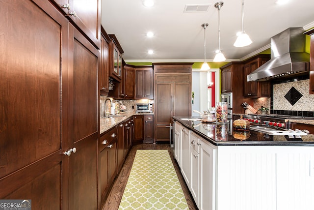 1365 Ivy Plantation, Monroe, GA 30656 - kitchen featuring wall chimney range hood, a sink, backsplash, a center island with sink, and recessed lighting