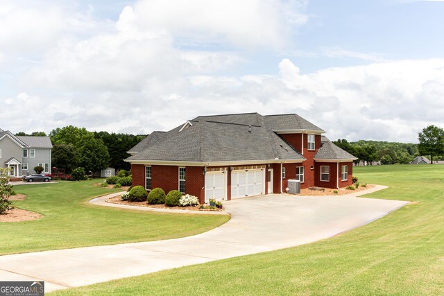 1365 Ivy Plantation, Monroe, GA 30656 - view of front of property with a garage, a front lawn, central air condition unit, and brick siding