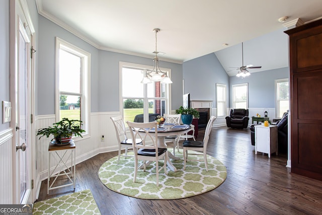 1365 Ivy Plantation, Monroe, GA 30656 - dining space featuring a fireplace, wainscoting, dark wood finished floors, vaulted ceiling, and ceiling fan
