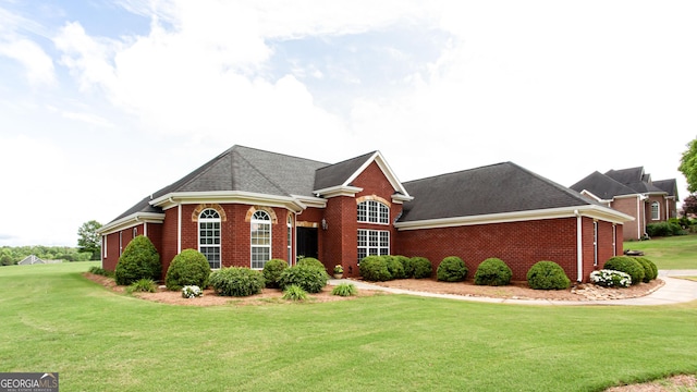 1365 Ivy Plantation, Monroe, GA 30656 - view of front facade with brick siding, a front lawn, and roof with shingles