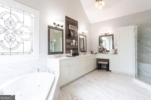 1365 Ivy Plantation, Monroe, GA 30656 - bathroom with marble finish flooring, a jetted tub, double vanity, plenty of natural light, and high vaulted ceiling